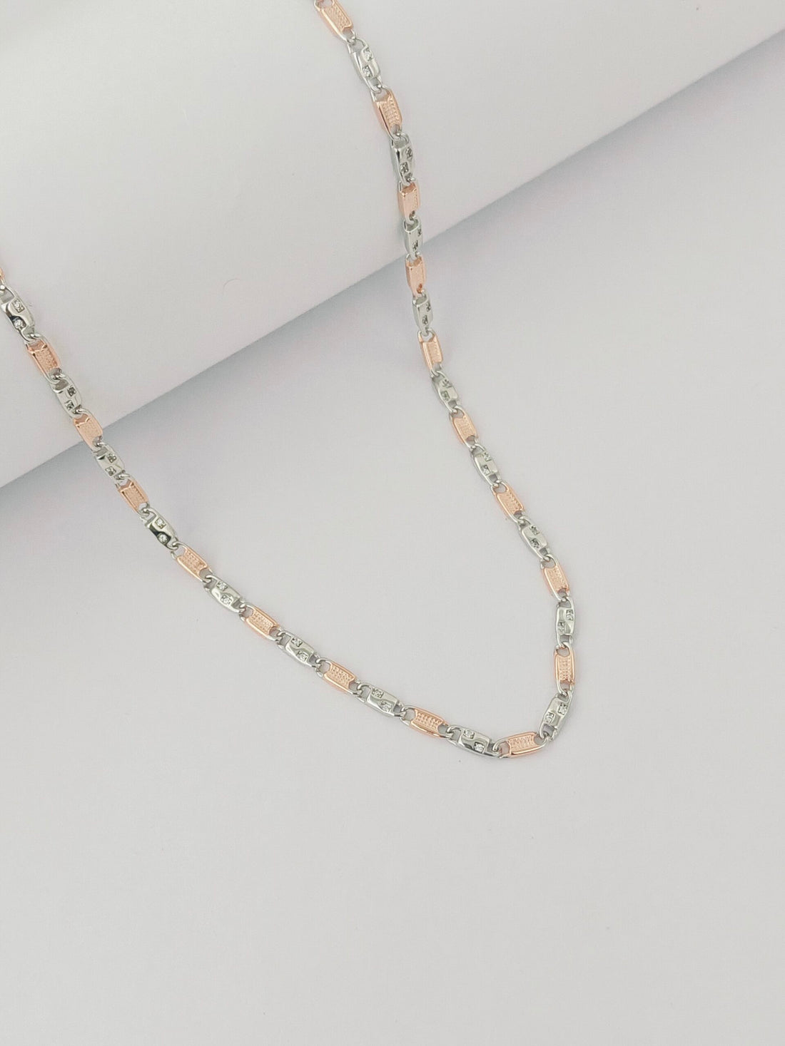 pink and silver beads on a light gray background by kivara jewels