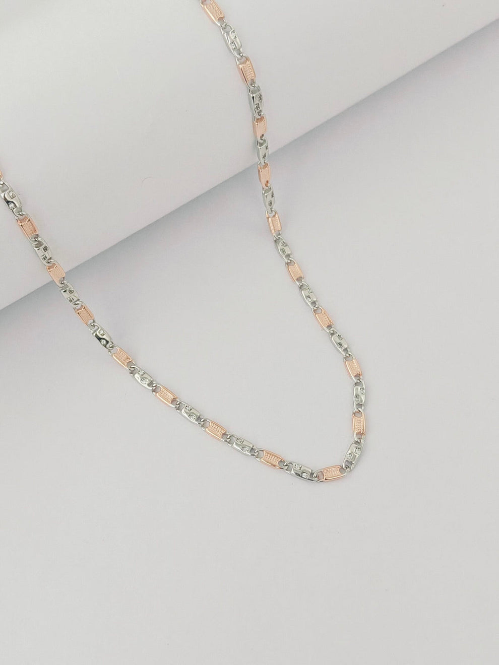 pink and silver beads on a light gray background by kivara jewels