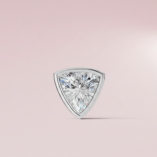 Trillion cut diamond on a light pink background