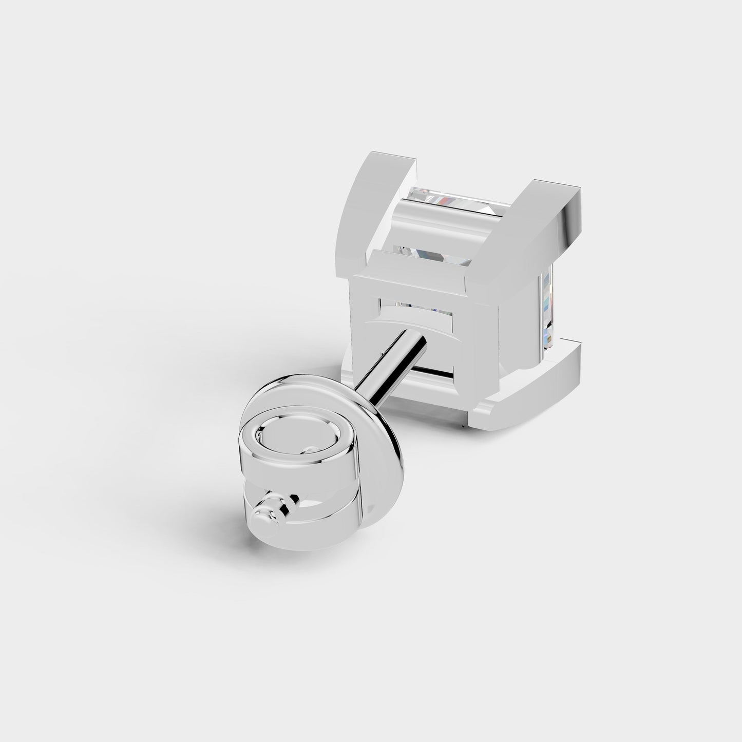 Silver cufflinks on a light gray background