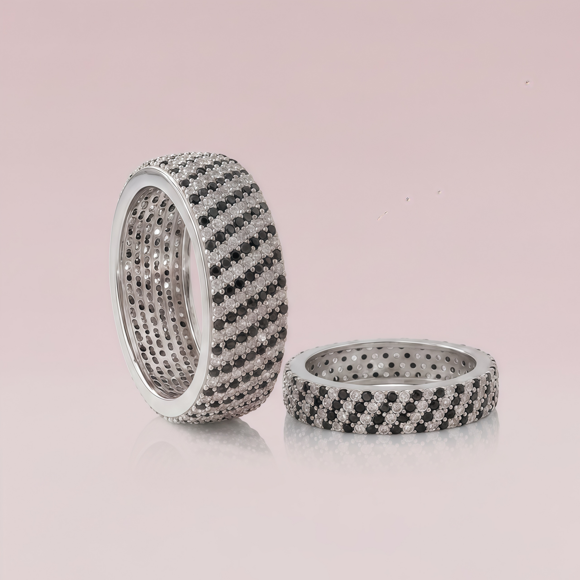 Sterling silver couple rings from Kivara Jewels, displaying intertwined bands with a polished finish.