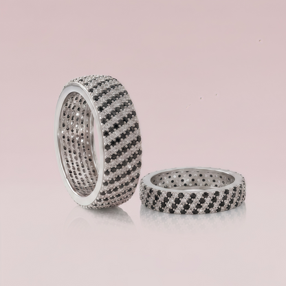 Sterling silver couple rings from Kivara Jewels, displaying intertwined bands with a polished finish.