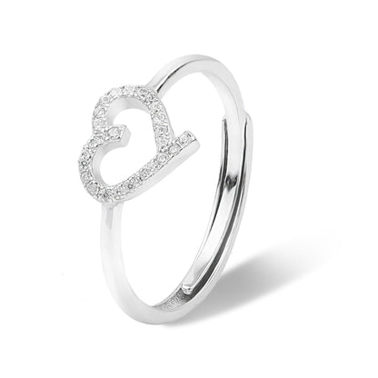 Silver heart-shaped ring with small diamonds on a white background