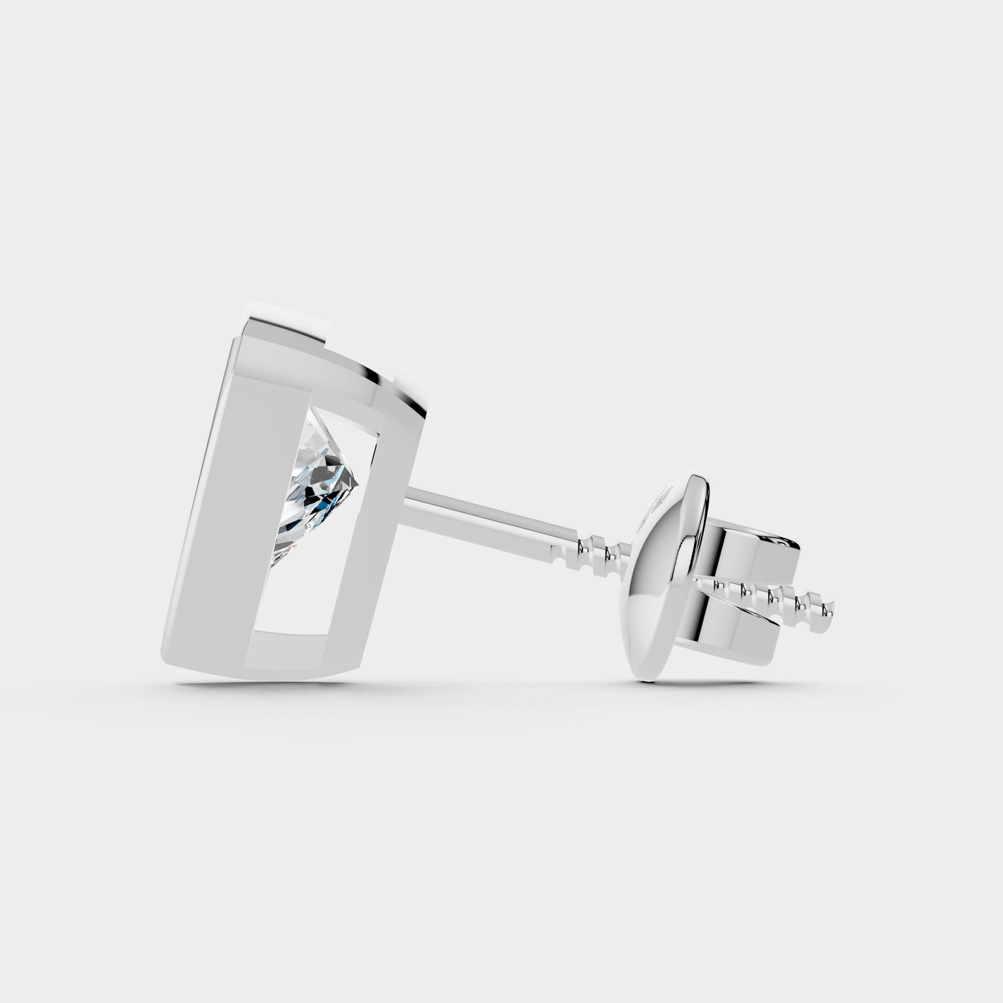 Silver stud earrings with a clear gemstone on a light gray background