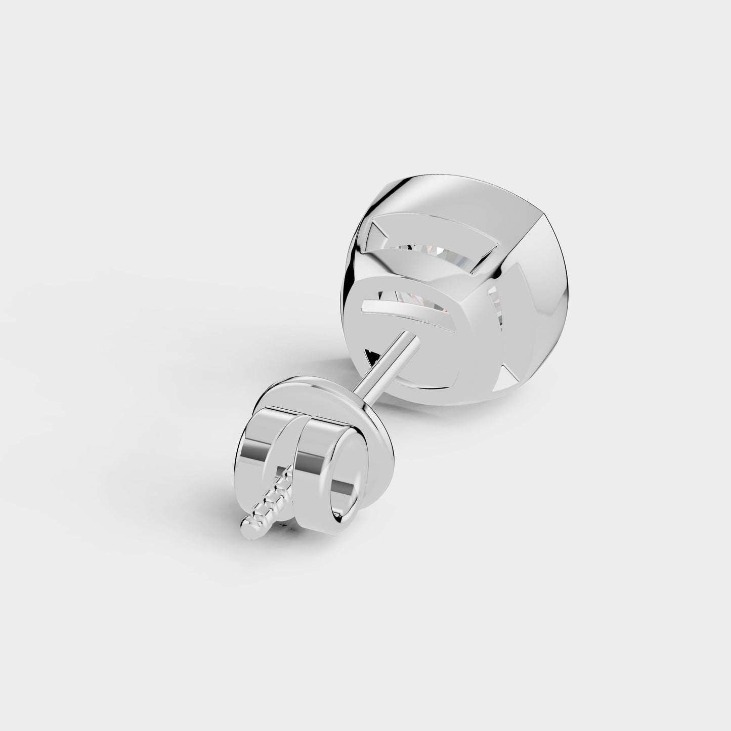 Silver earrings on a light gray background
